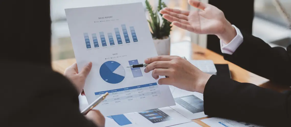 Melbourne-based business owner reviewing valuation documents with a financial advisor